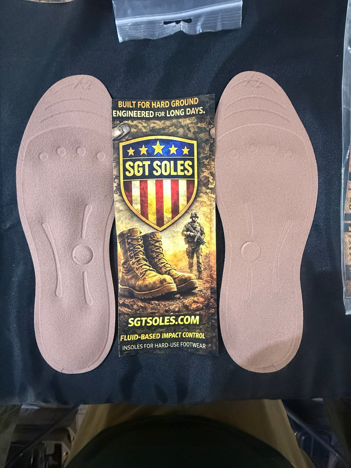 Pair of SGT Soles fluid-based work boot insoles with product information card